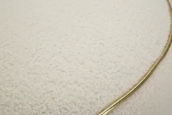 Poltrona cilindrica in tessuto con braccioli crema e oro - Pratesi